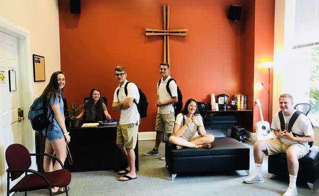 Students smiling in our Center for Campus Ministry