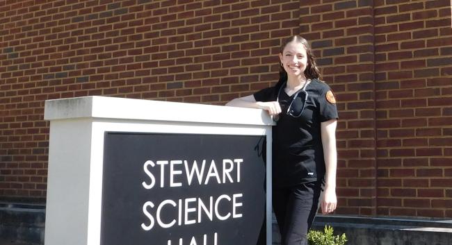 Nicole Simeone with Stewart Science Hall sign