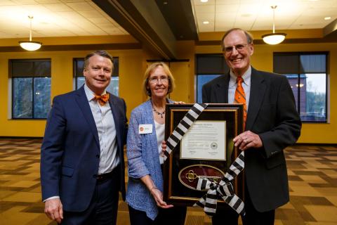 Chuck and Shirley Baily with President Lee receiving Golden Key Award