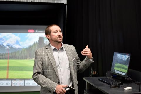 Smithley demonstrating equipment at the "Swing Lab" ribbon cutting