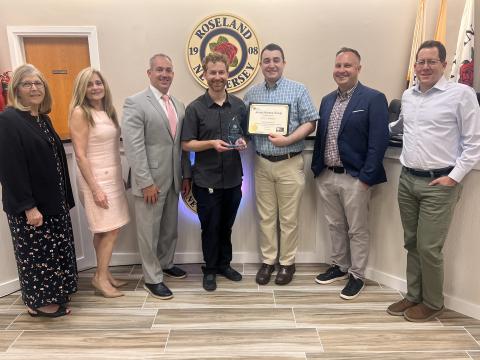 Ryan Schwertfeger pictured holding certificate