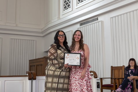 Dr. Sherry Zak presenting the Academic Achievement Award to Taylor Brown