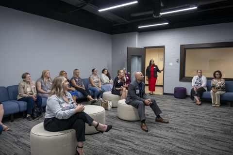 Attendees in the new state-of-the-art Nursing Immersion Room, a fully enclosed room with three additional interior walls that create an amphitheater-style environment to deliver a fully immersive interactive learning experience that places students at the center of realistic clinical scenarios and team-based patient care