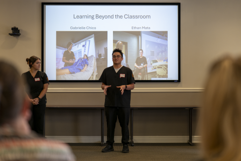 Gabrielle Chico and Ethan Mata presenting at the event