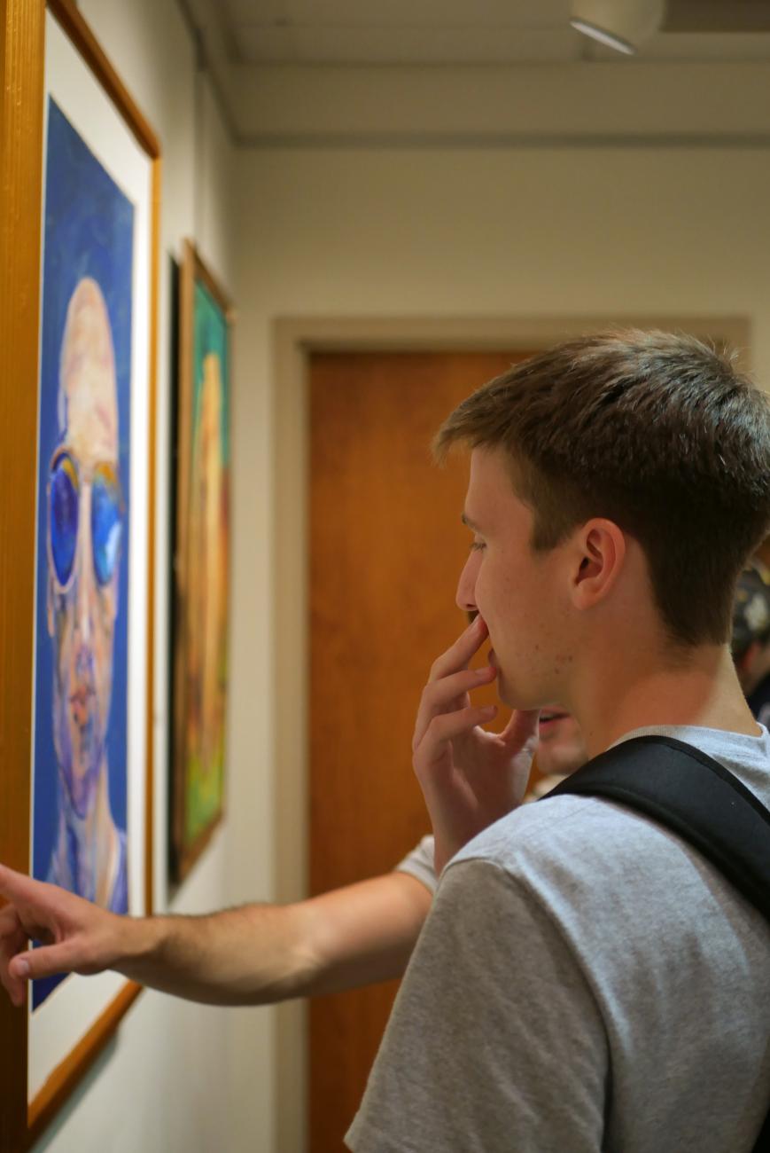 student viewing art