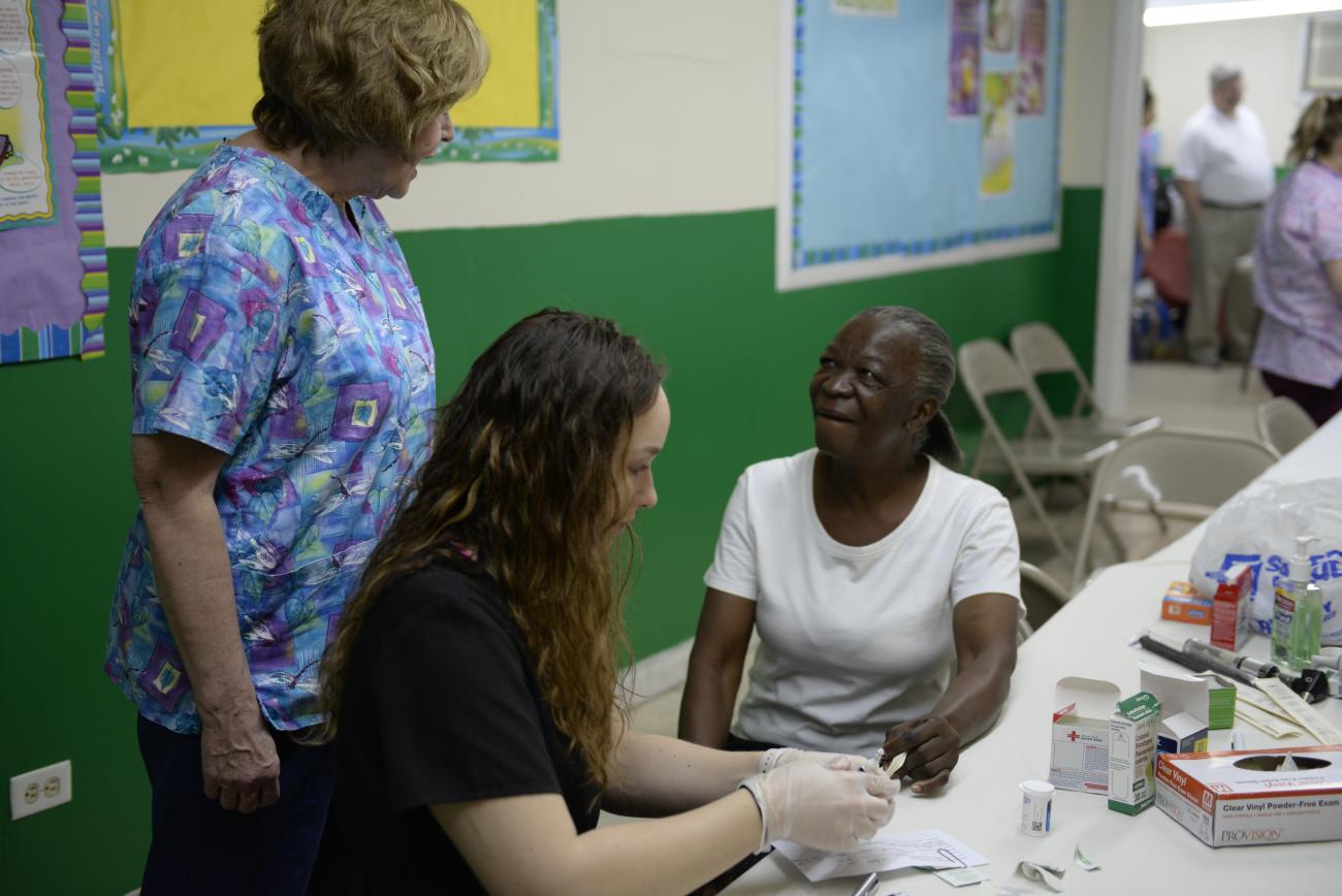 Nursing student helping others