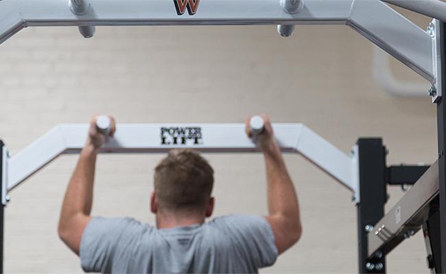 A student training in our weight room