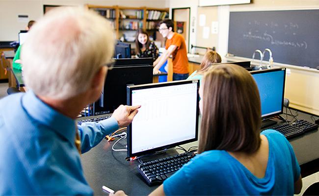 Students learning in their economics classroom