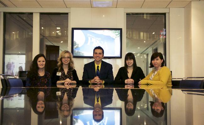 Public Relations students in a board room