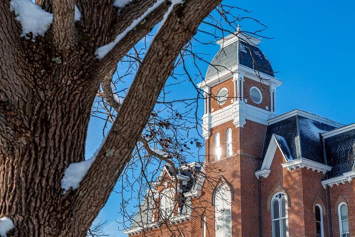 Miller hall and tree in winter with snow