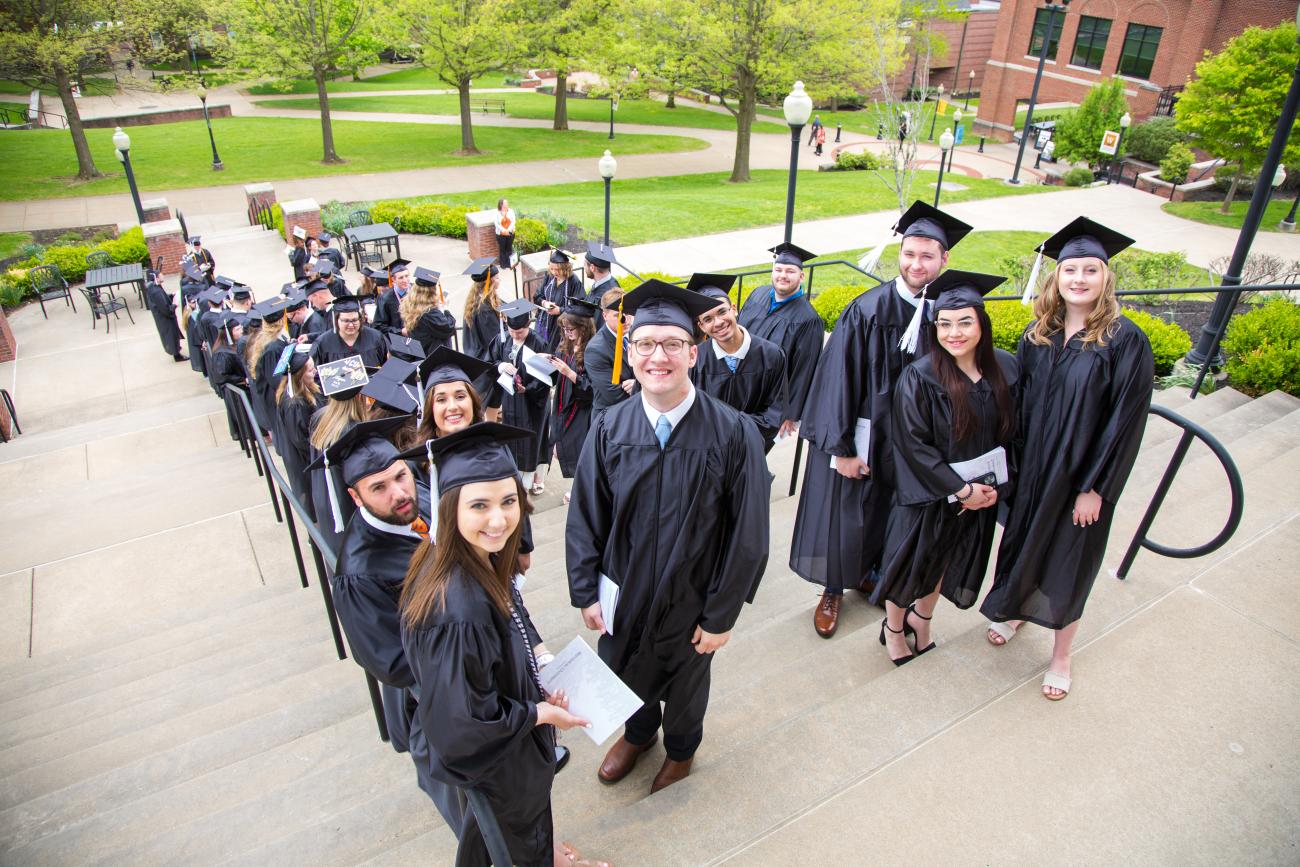graduates on steps 