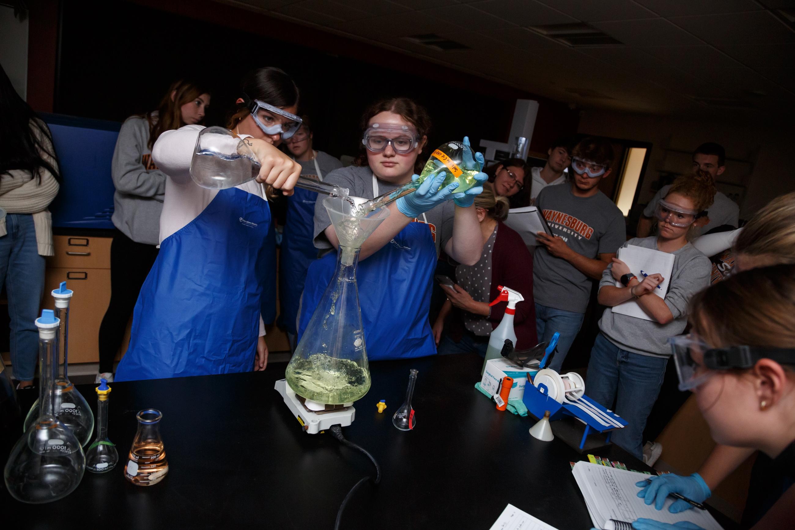 students in a lab conducting an experiment