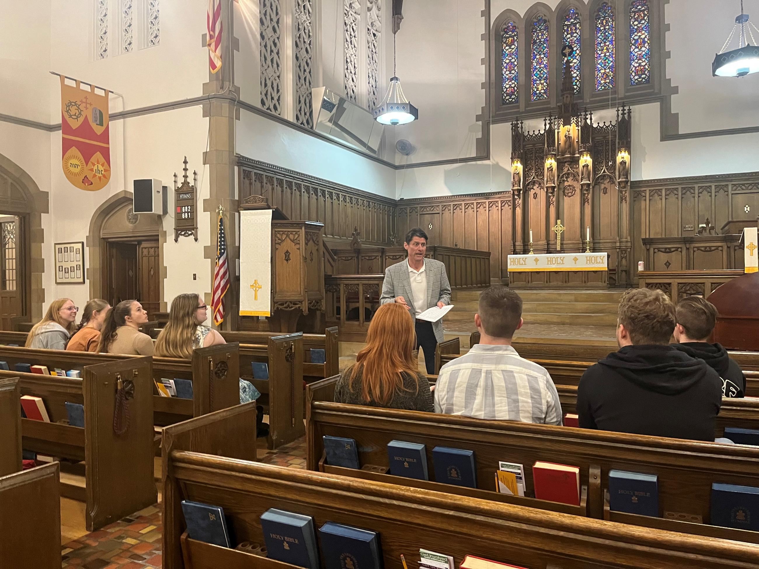 Rev. Dr. Younger gives students a tour of Church of the Covenant