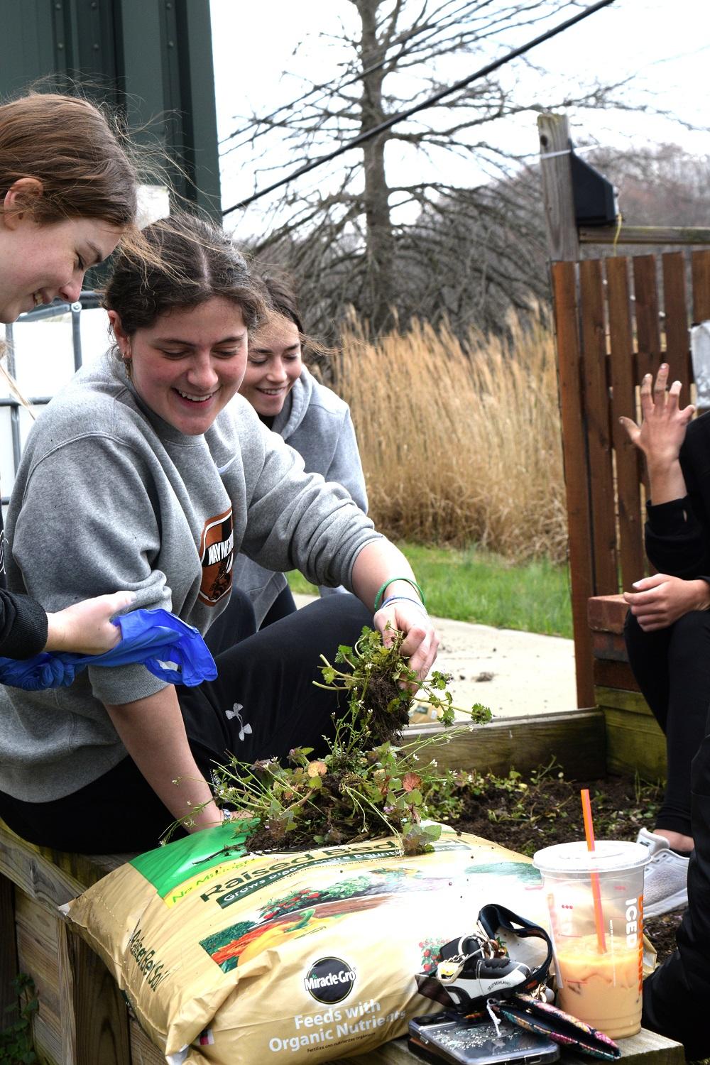 students gardening 