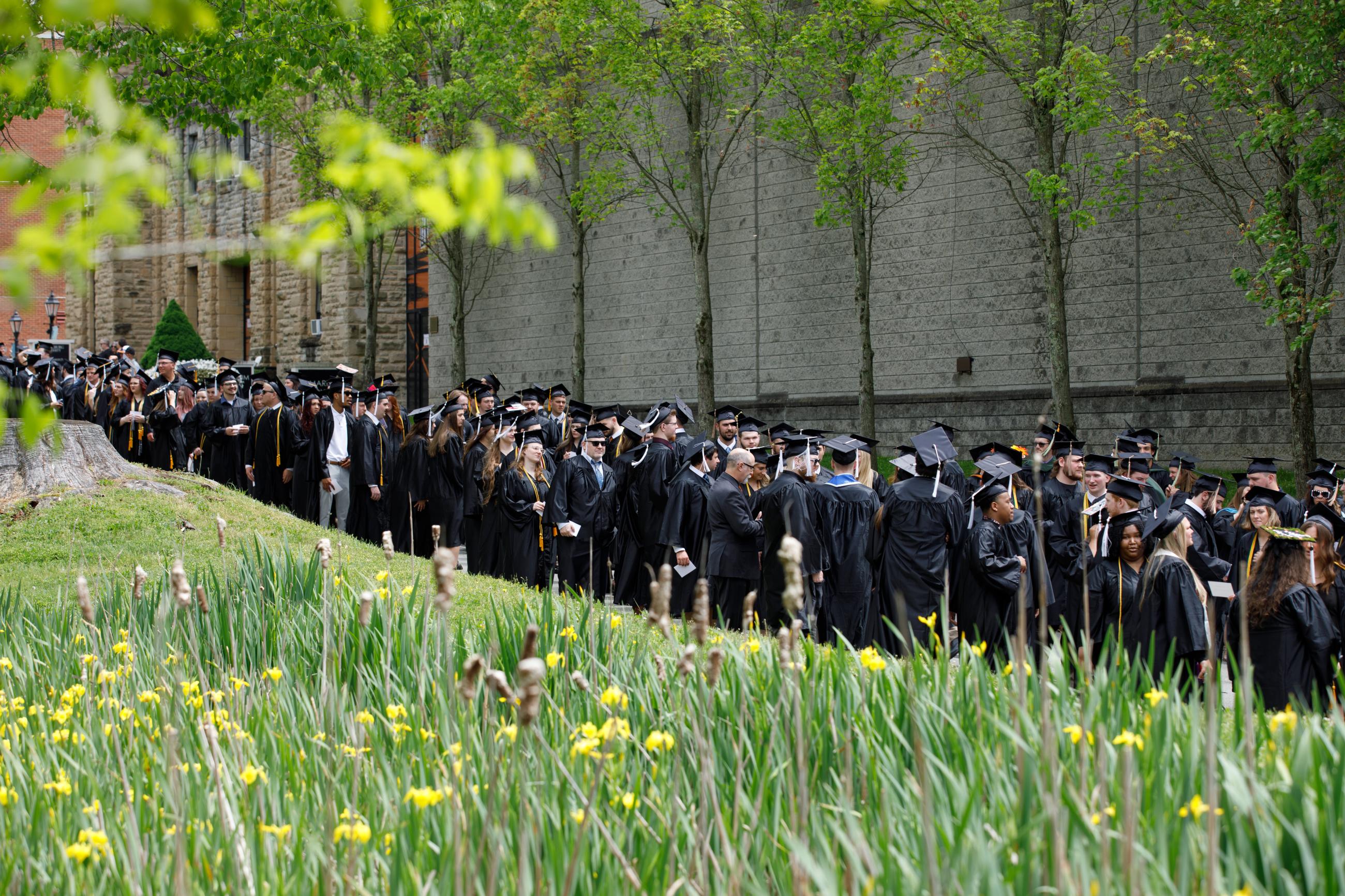 graduates lining up for processional