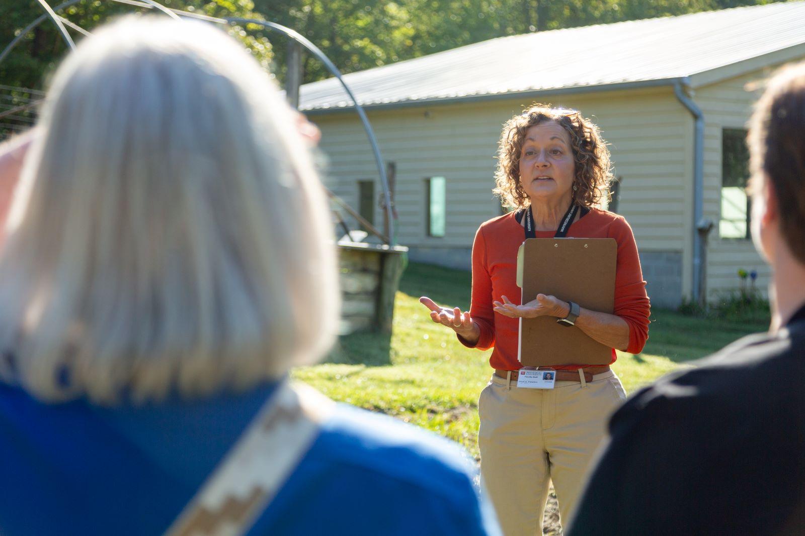 WU faculty member shows property at Alston Farm