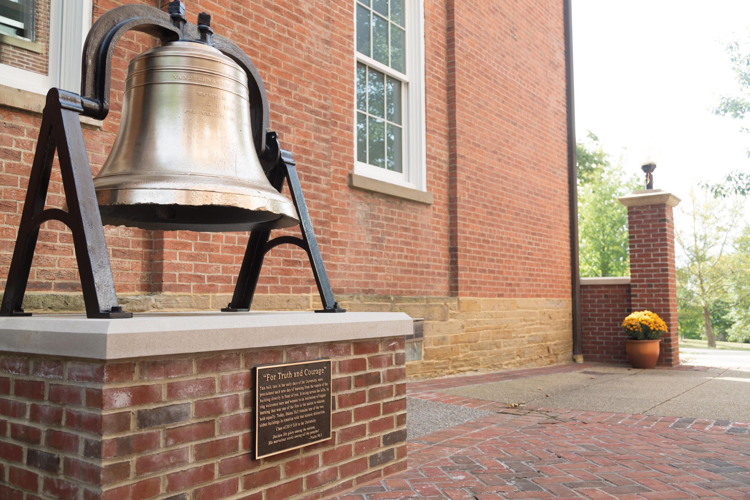 The restored bell from Hanna Hall sitting outside the building in Cusick Court