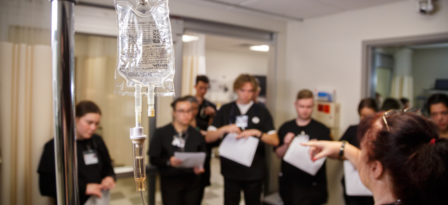 WU nursing students in hospital simulation classroom on campus