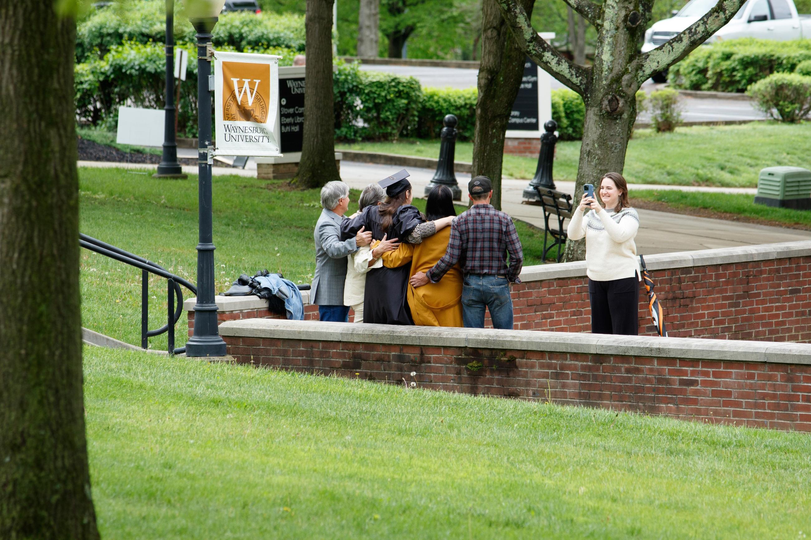 family in the park taking a photo