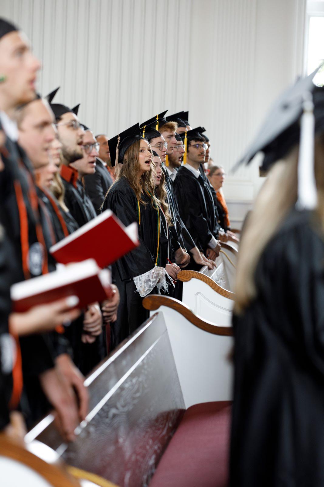 Graduates sing hymns during Baccalaureate service