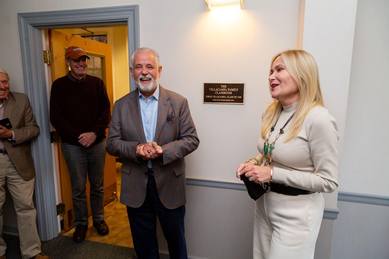 Jorge and Maggie Villacampa pose next to the Villacampa Classroom plaque