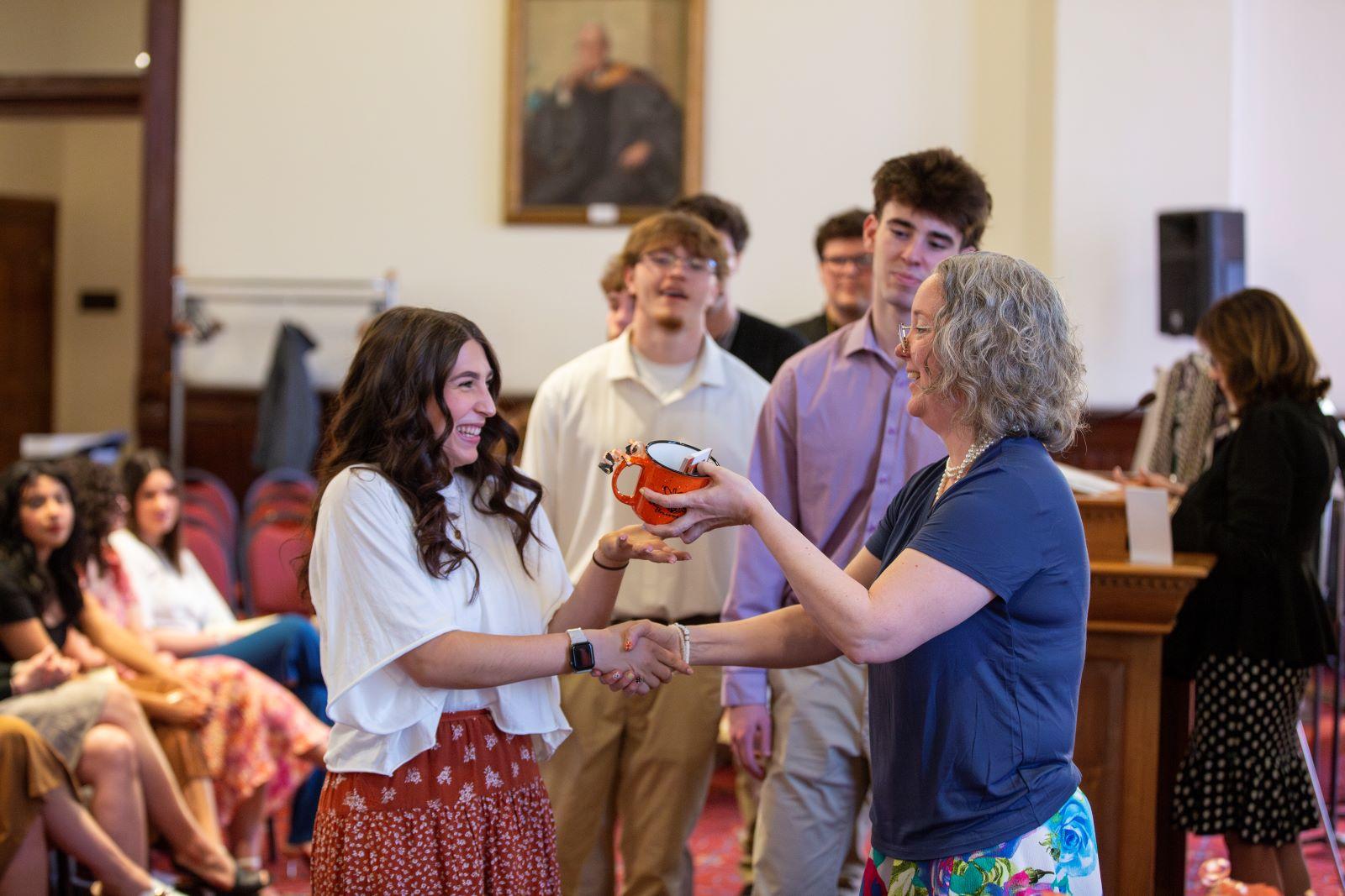 Dr. Kelly McGurgan celebrating with sophomores