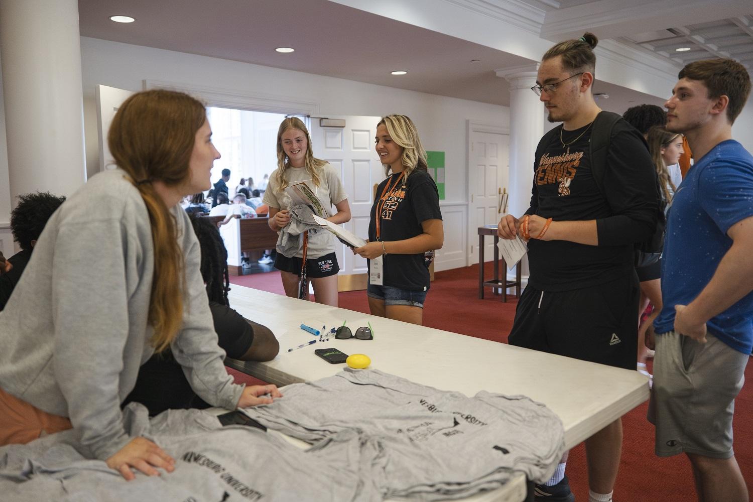 t shirts being handed out at orientation 