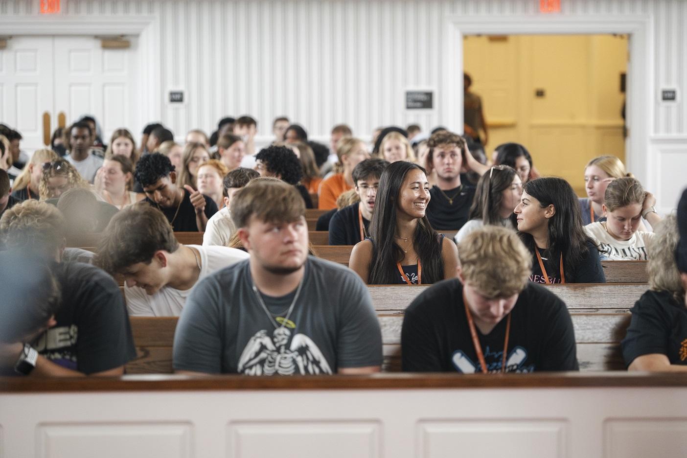 student at orientation meeting