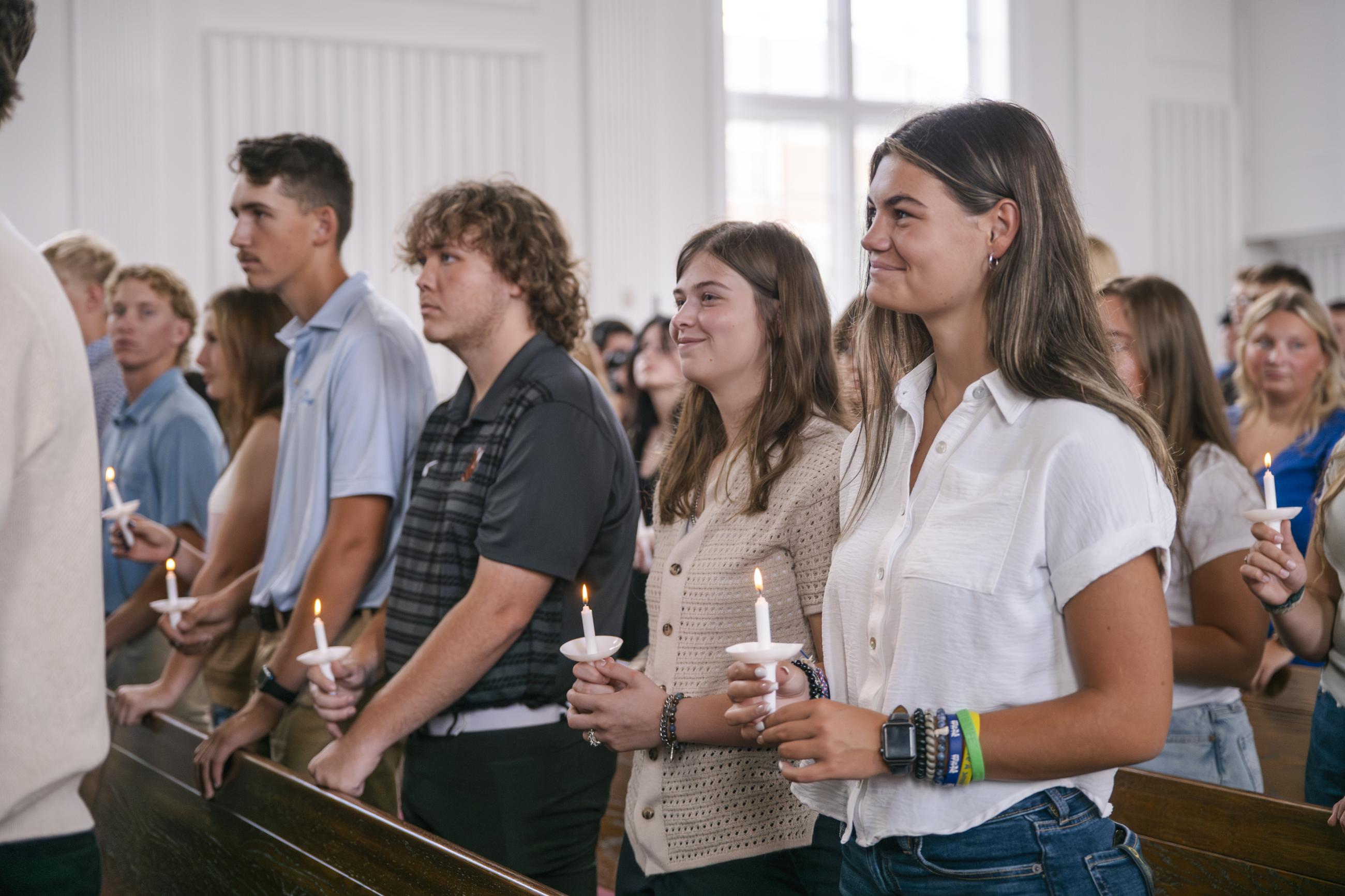 New students hold candles during Matriculation Ceremony at Waynesburg University