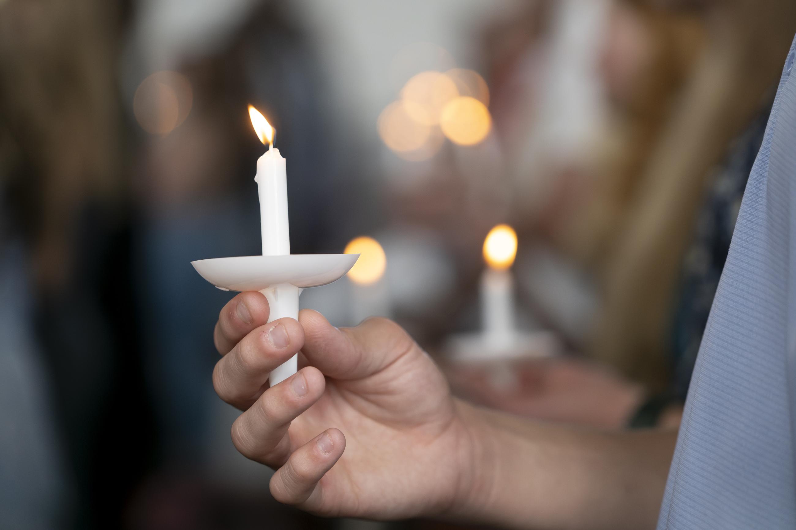 Students holding their candles