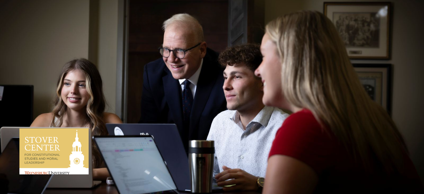 Dr. Stratton and Stover Scholars talk around a table