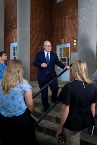 Dr. Stratton and Stover Scholars on the steps of Eberly Library