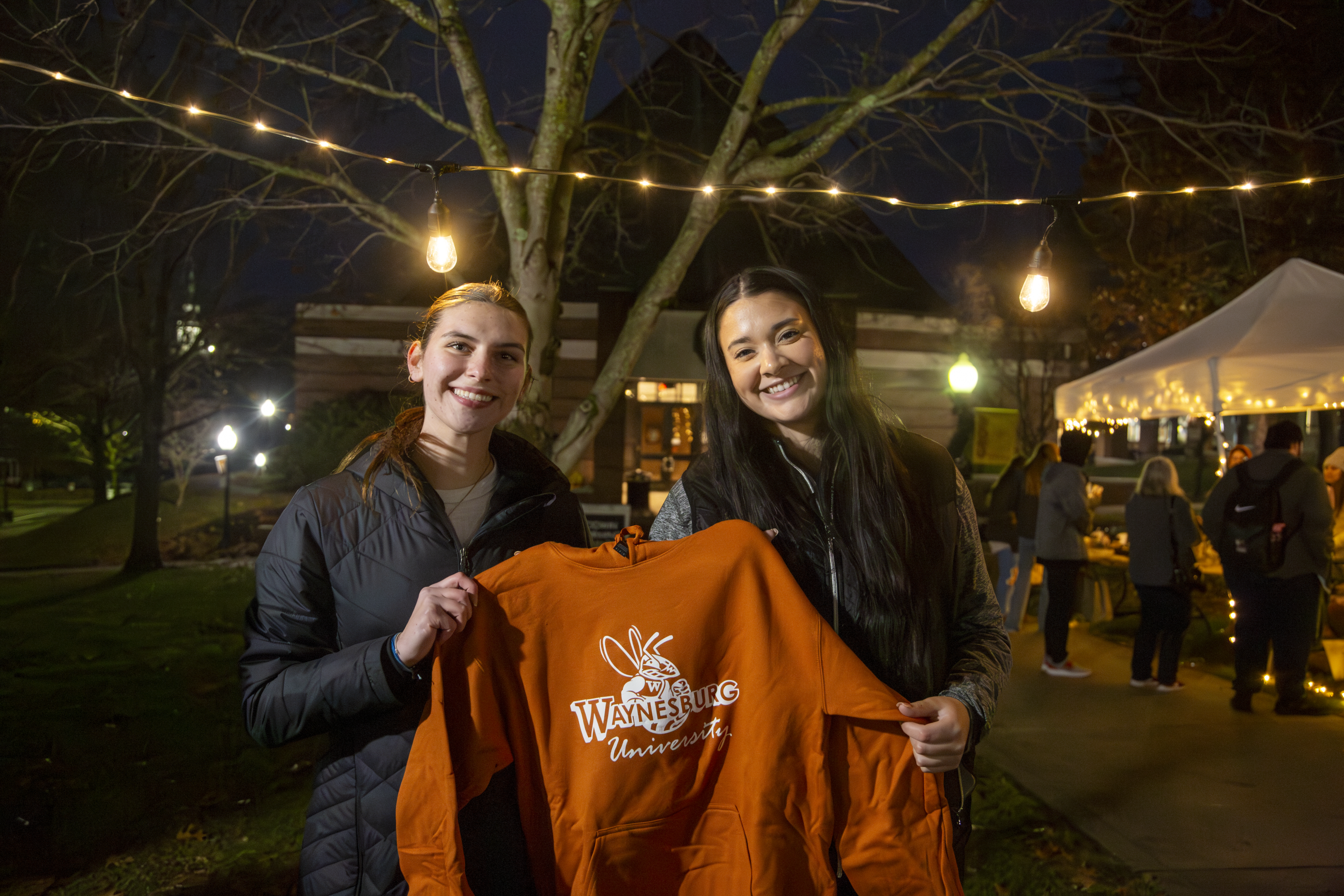 Students selling items from The Nest