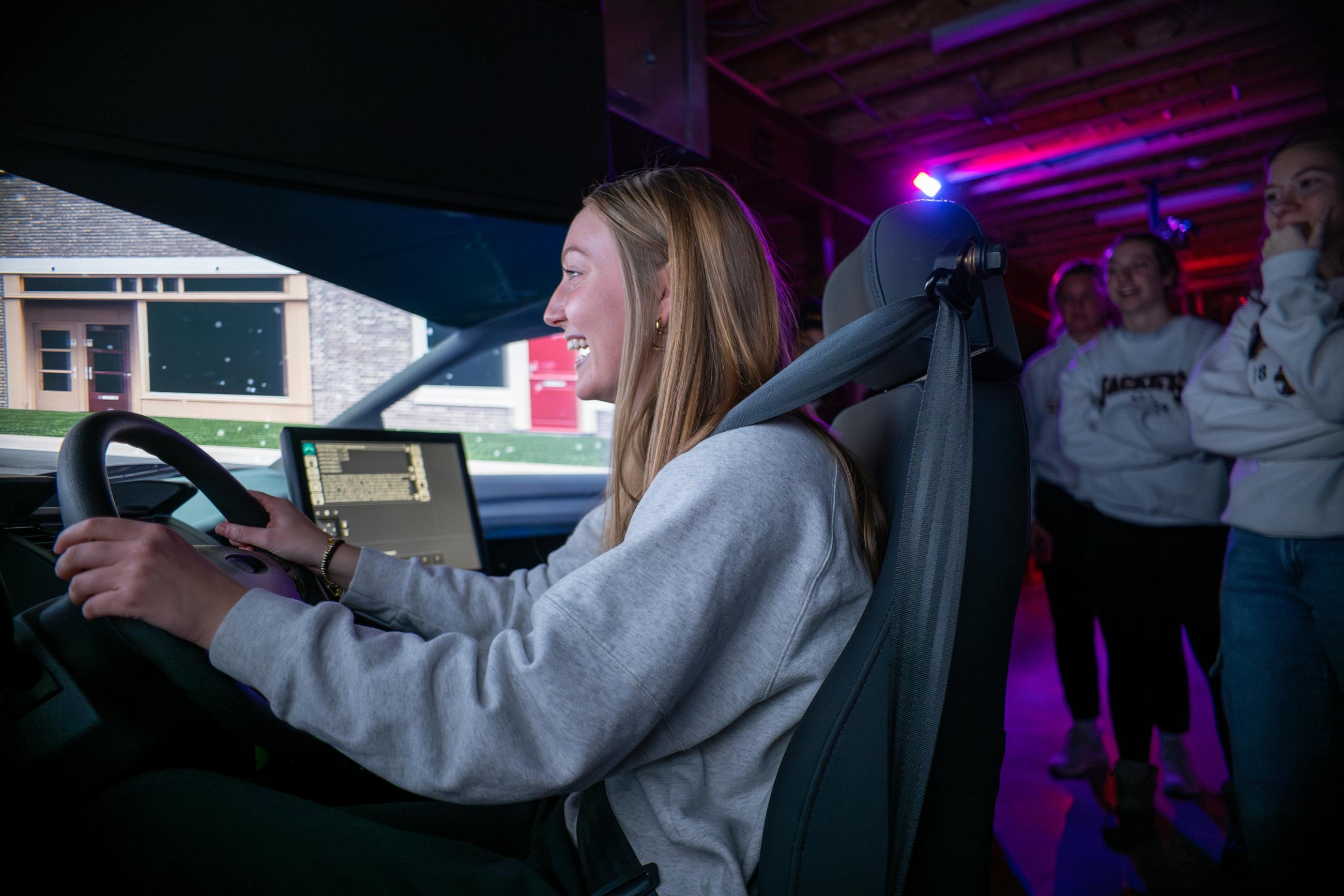 Waynesburg University students using the patrol simulator