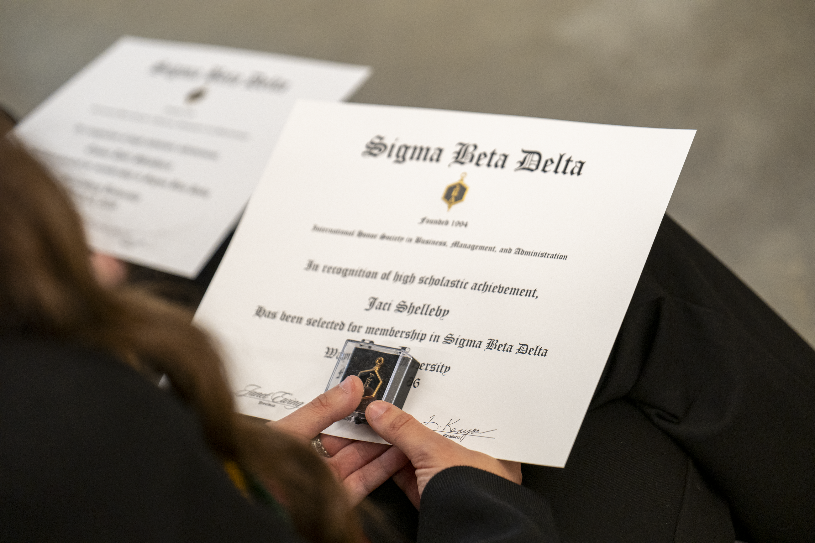 Students holding their award certificates