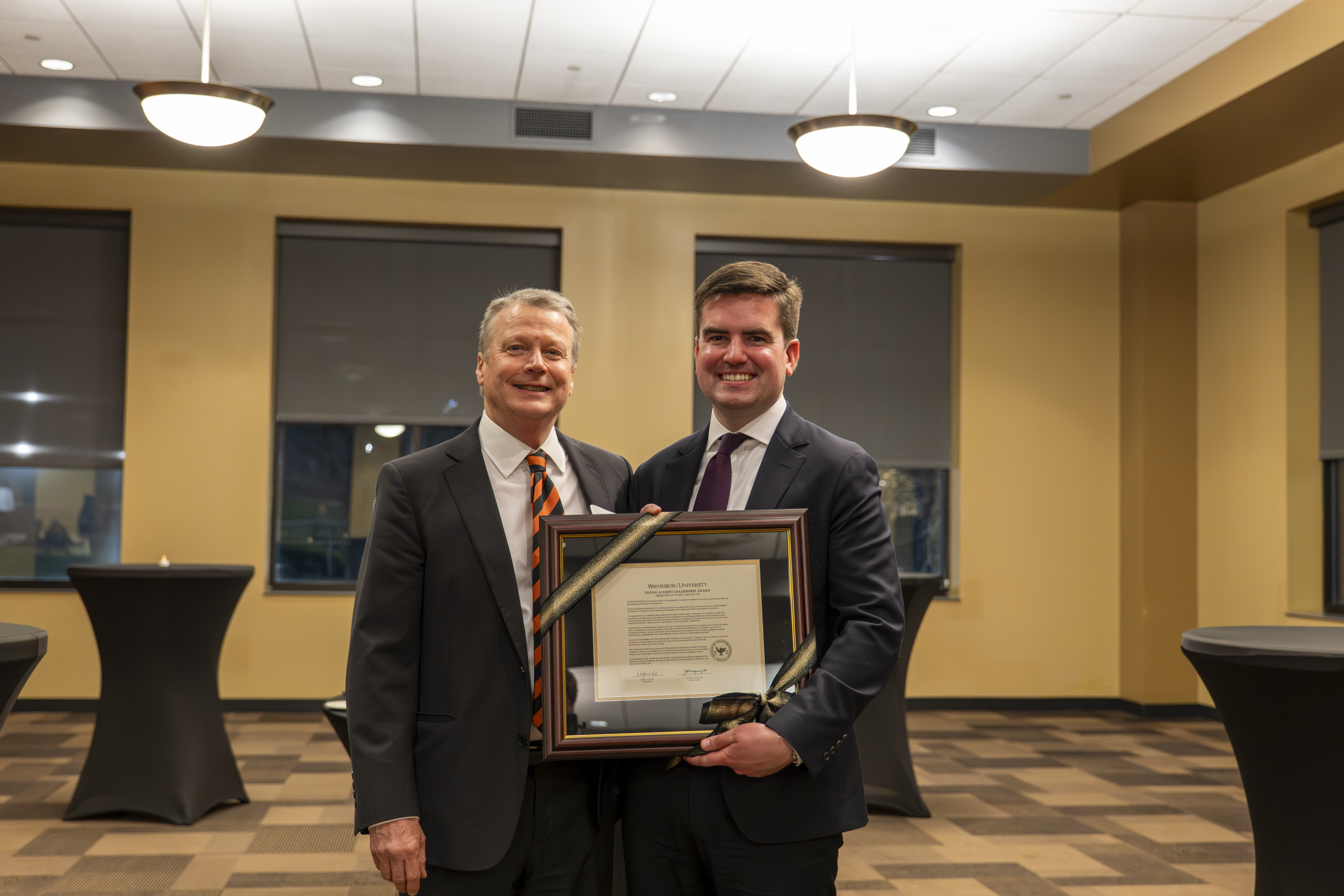 President Lee pictured with Young Alumni Leadership Award winner, Tyler D. McCoy ('18)