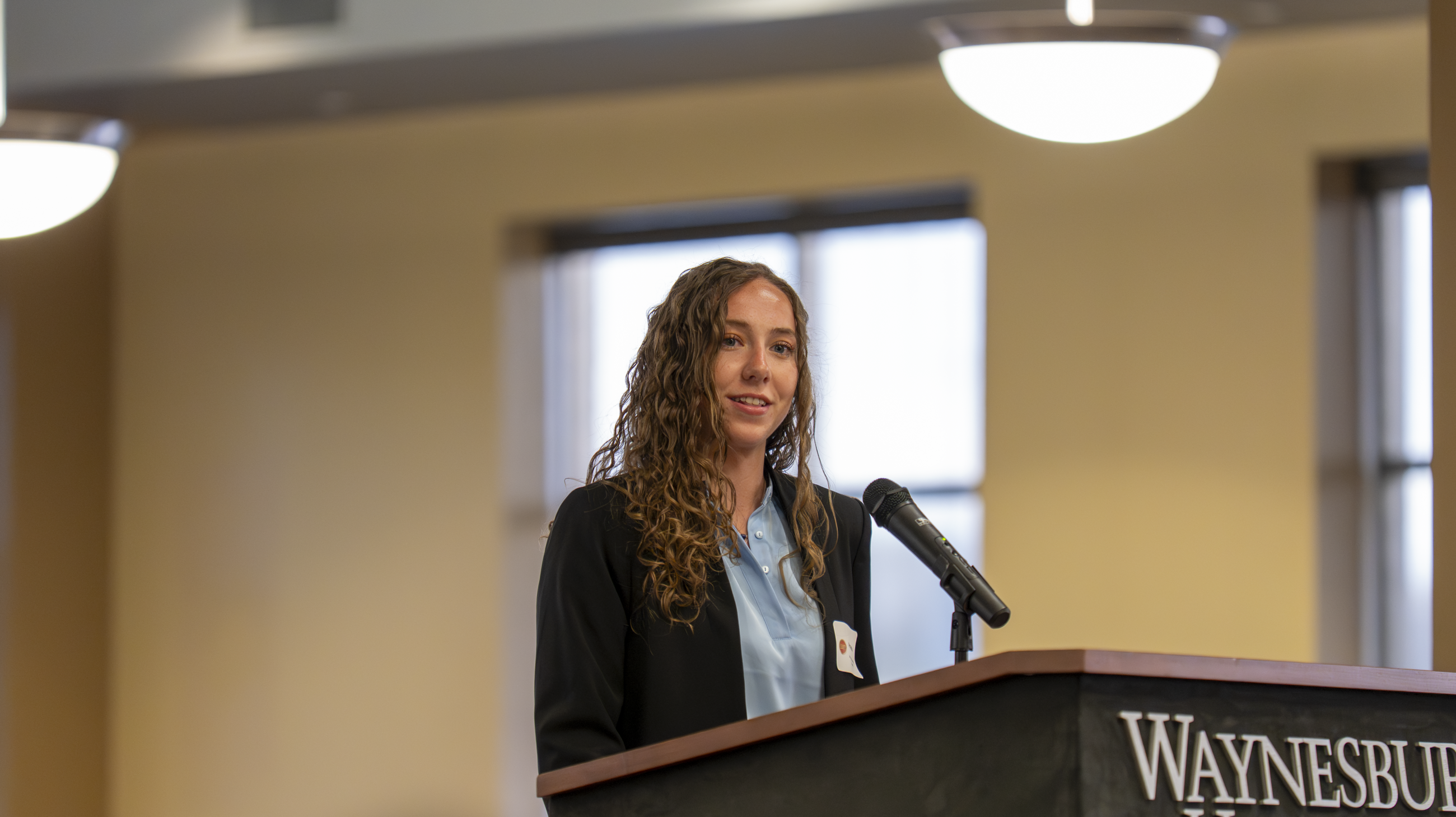 Amanda Sweeney, senior Finance major, delivered remarks at the event