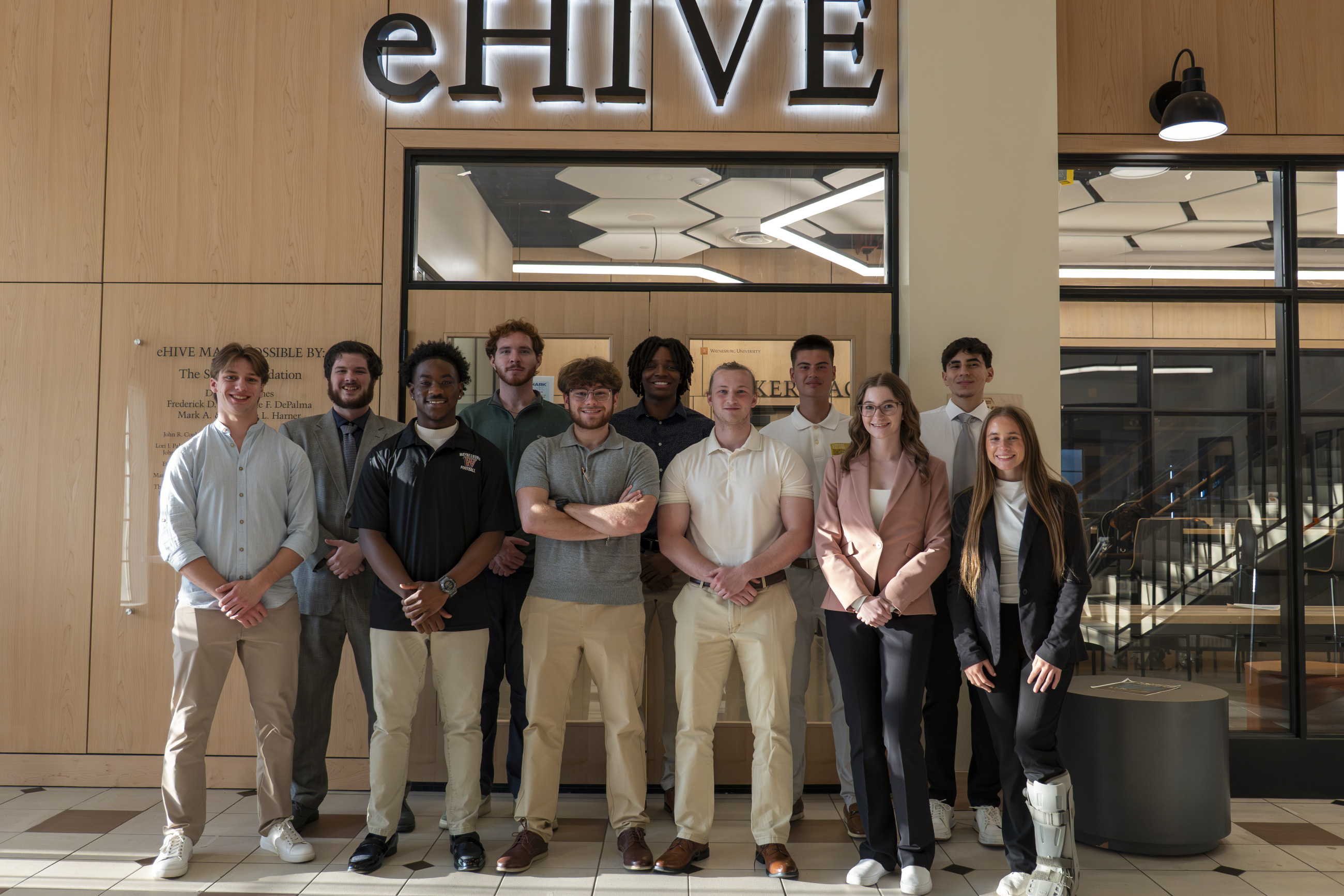 Shark Tank competition participants pictured in front of the eHIVE in Stover Campus Center