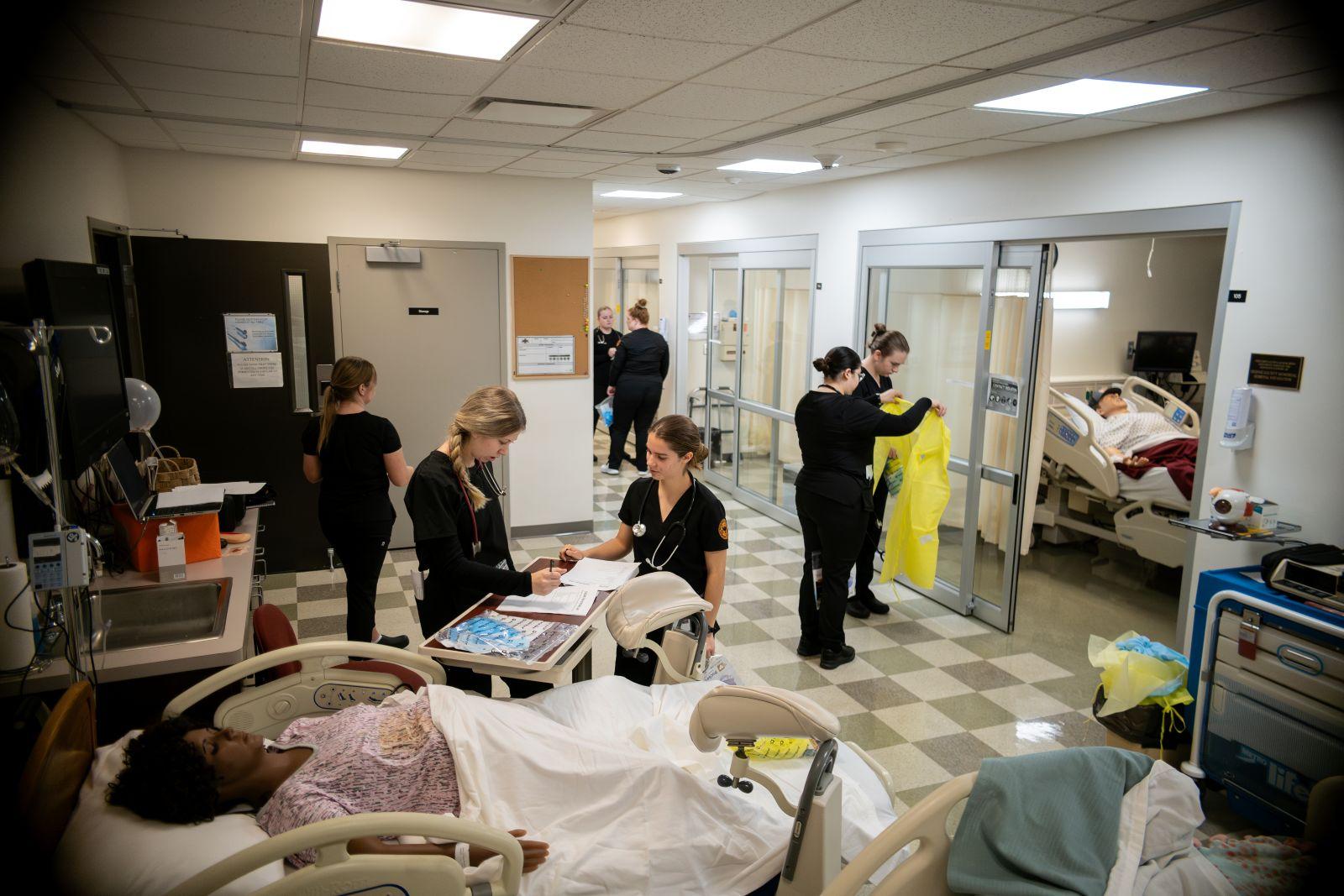 Waynesburg nursing students are seen in the Nursing Clinical Learning Center, which is set up to look like a real hospital setting.