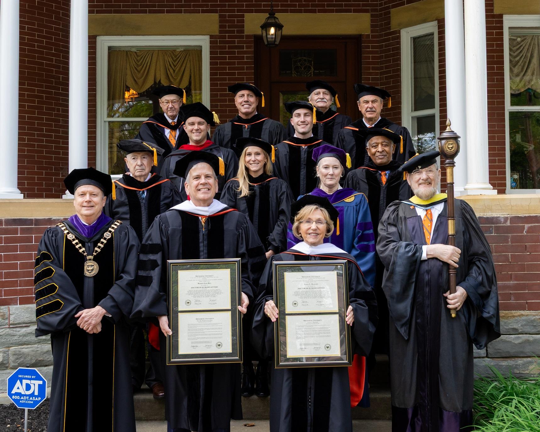 Trustees and speakers in regalia posing as a group.