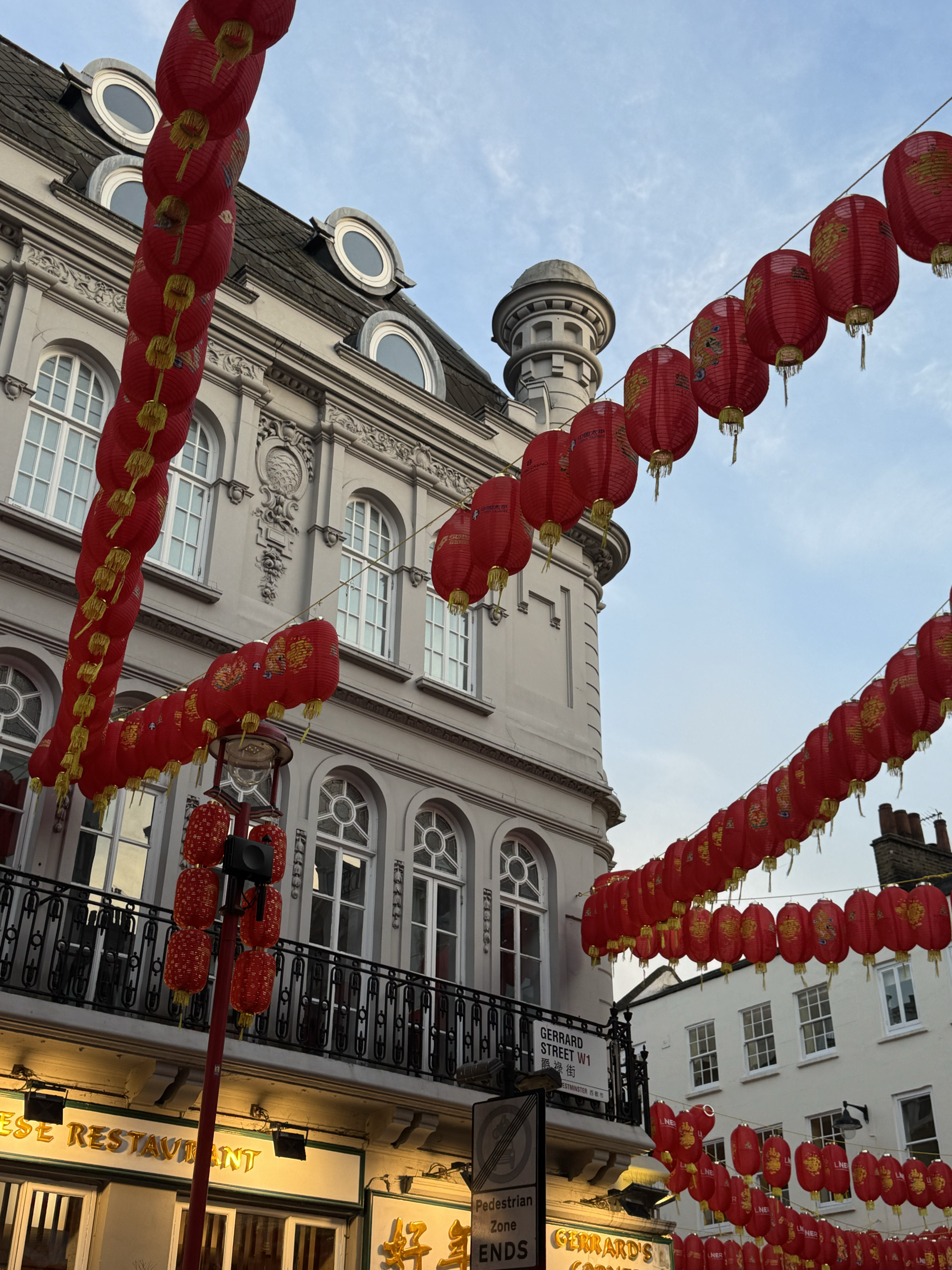 Red lanterns hang from building to building in London's Chinatown