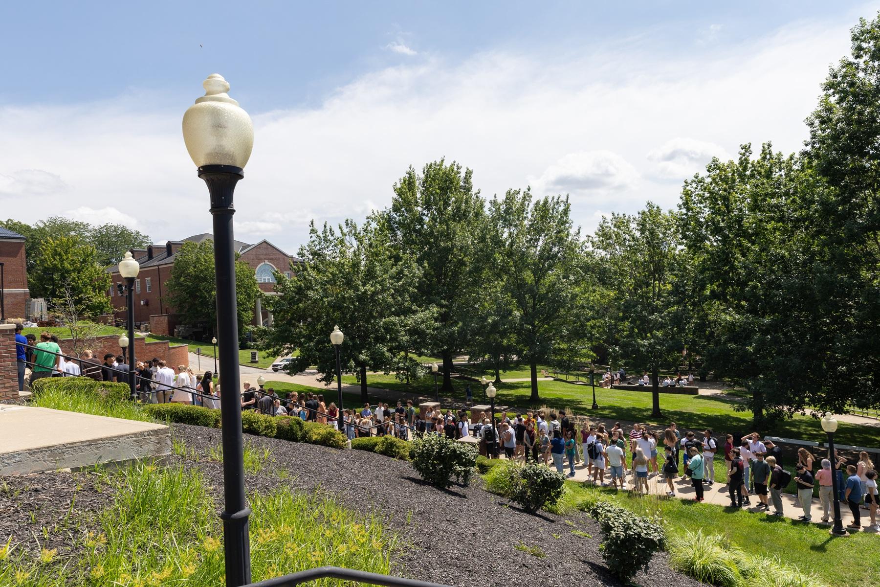 Students line up on the steps outside the chapel.