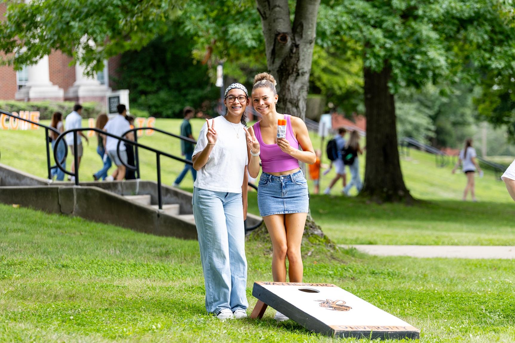 Two students pose with ice cream.
