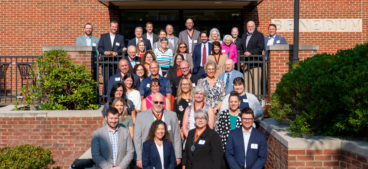 Attendees of the President’s Partner Recognition Breakfast pictured on the cement steps outisde Benedum Dining Hall on the University's campus
