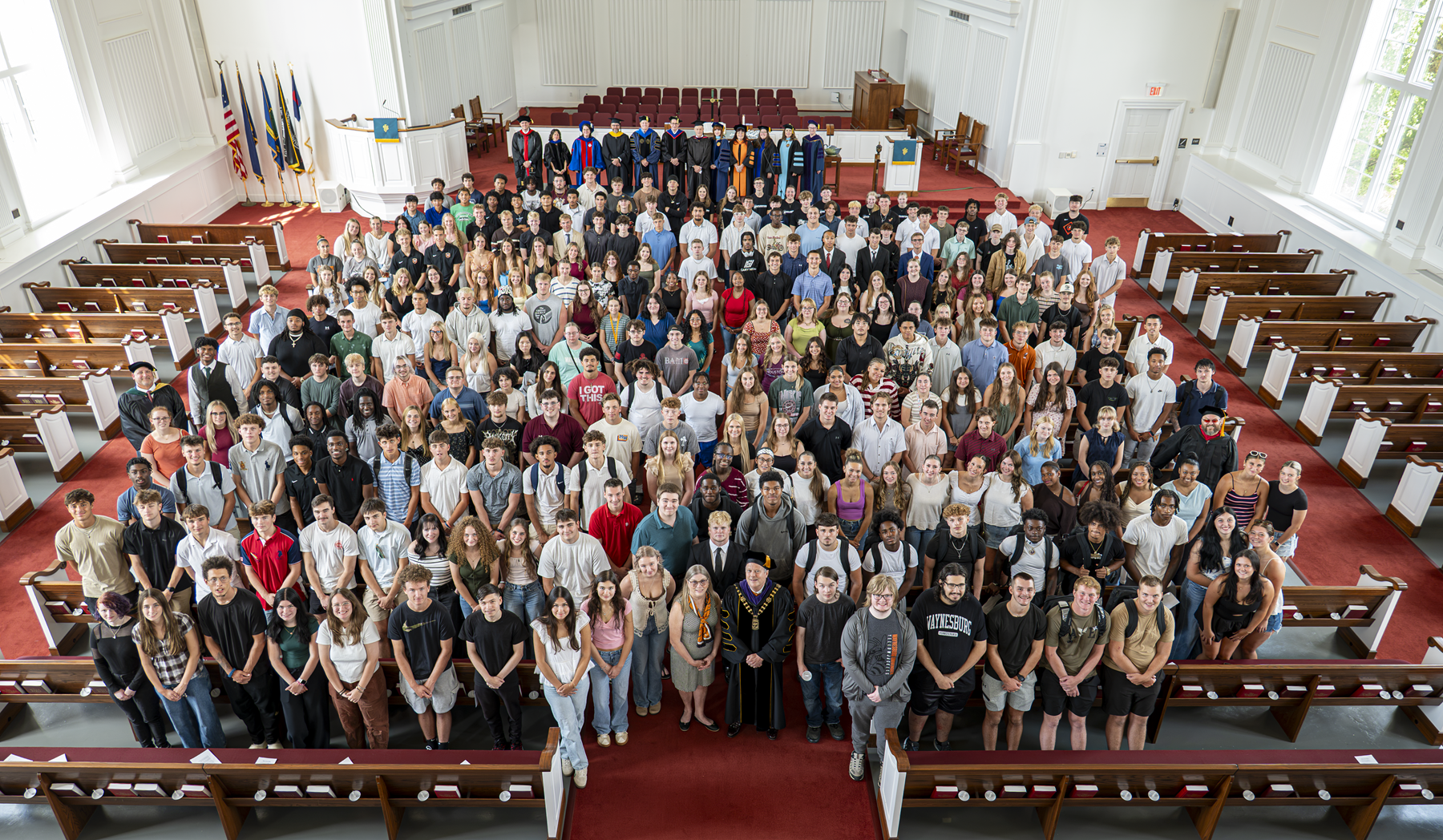 The class of 2030 post for a group photo in the Chapel.