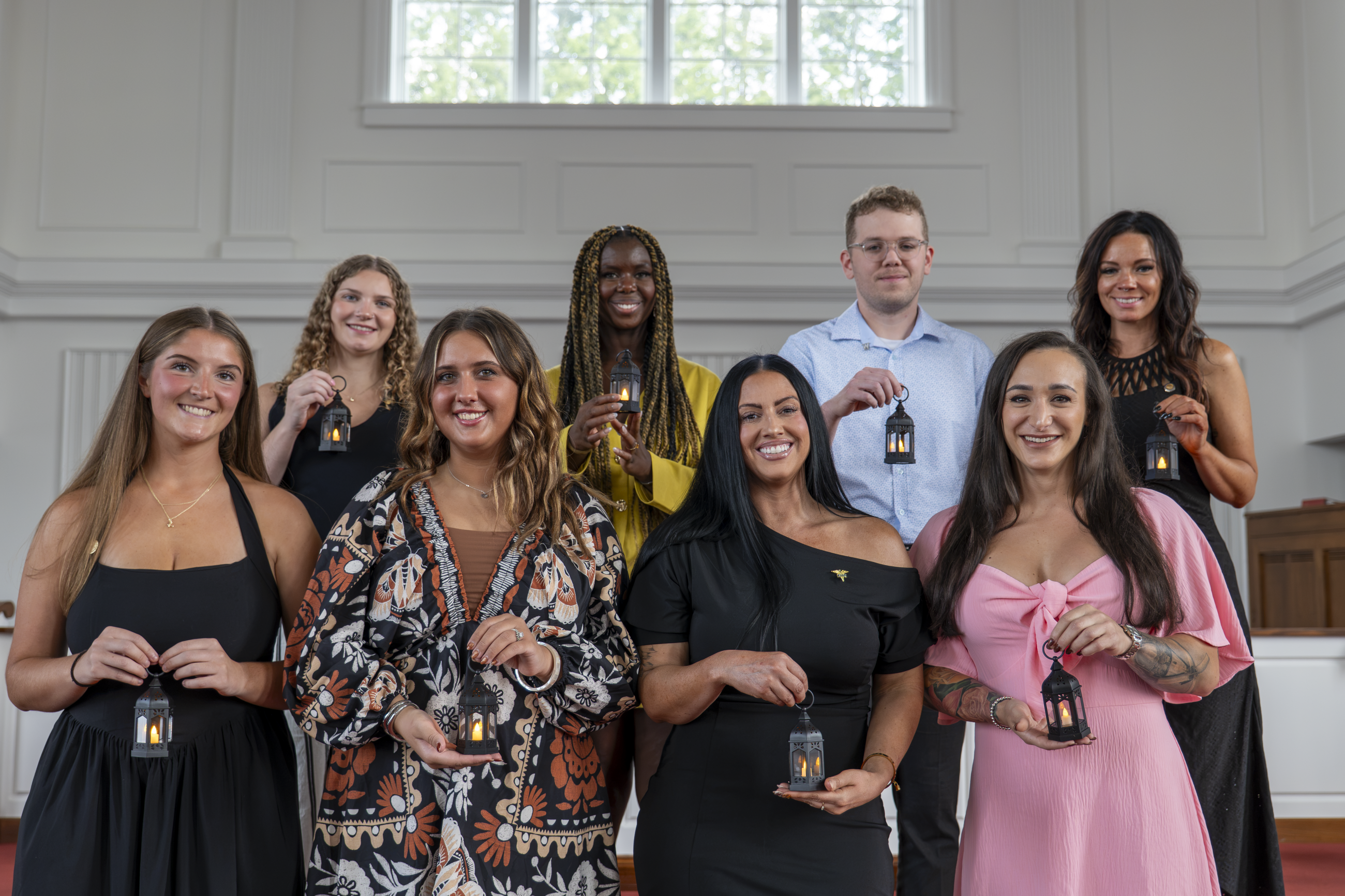 The graduating cohort of the Waynesburg University Hybrid Second-Degree Bachelor of Science in Nursing program pictured in Roberts Chapel at their Pinning Ceremony