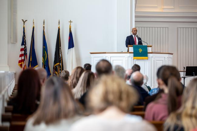 Dr. Georj Lewis speaks in Roberts Chapel