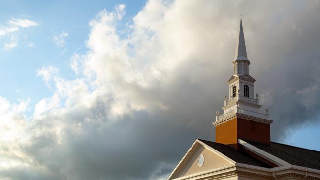 Roberts Chapel looms overhead as clouds drift above it.