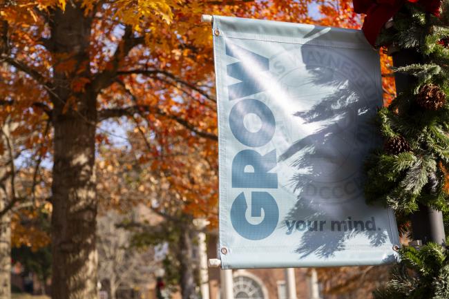 Waynesburg University banner with fall leaves