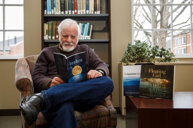 Dr. Robert Randolph with his three published poetry manuscripts